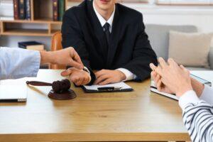 A couple takes off their wedding rings and hands them to a lawyer. In Connecticut, an uncontested divorce describes a divorce where both spouses agree on the main terms before asking the court to step in.