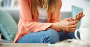 A woman looking at her wedding ring, wondering if she should get a divorce