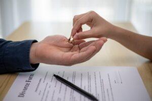 A woman gives her wedding ring back to an ex-partner as part of her preparation for divorce in CT.