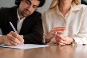 A couple begins their divorce proceedings in a lawyer’s office.